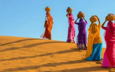 Women carrying water in the desert