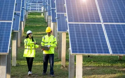 Engineers with architects examining solar power plant,Solar station development concept