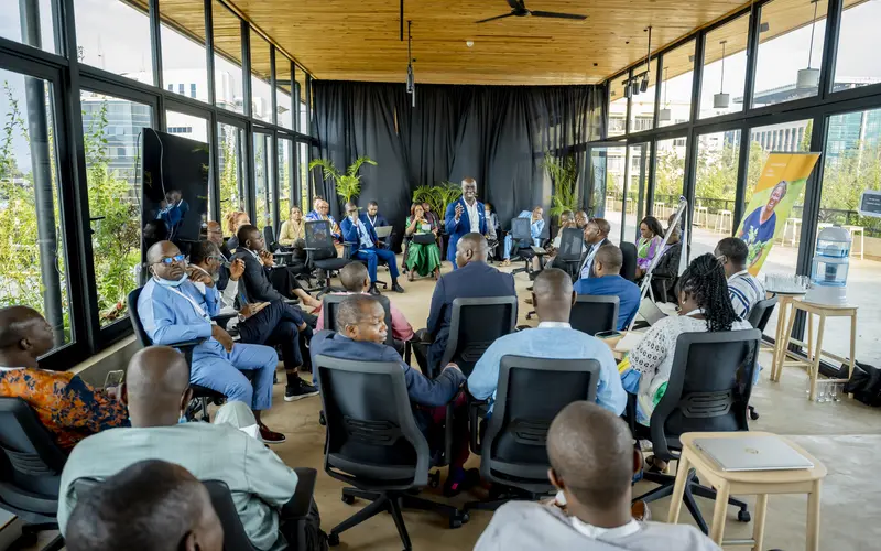 Participants take part in a group discussion at the NDCs 3.0 Regional Forum for Africa in Kigali, Rwanda, in October 2024, with one participant speaking to the group.