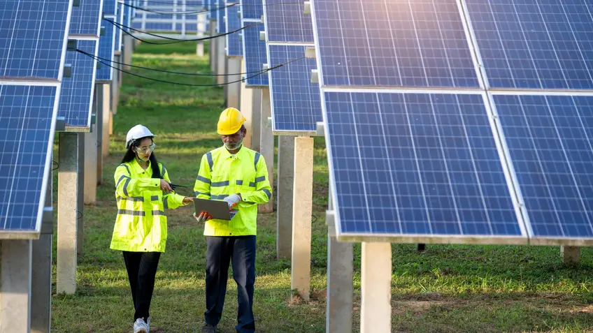 Engineers with architects examining solar power plant,Solar station development concept