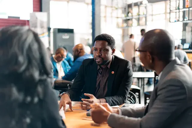Participants engage in a small-group discussion during the Project Checklist launch in Nigeria in 2025.