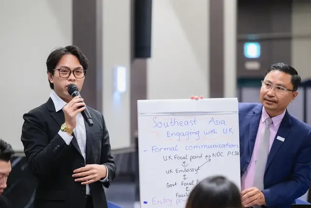 Participants present group work during a Facilitators Workshop in South Korea, 2026.